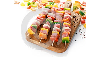 Uncooked meat and vegetable kebabs