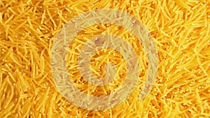 Uncooked Noodles that Slowly Rotating Counterclockwise