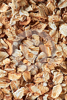 Uncooked oat flakes as a background. Close up, top view, high resolution product. Healthy food Concept.