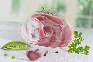 Uncooked organic hock of lamb meat in kitchen