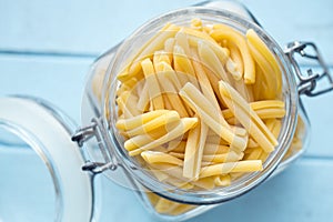 Uncooked pasta caserecce in jar