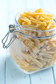 Uncooked pasta caserecce in jar