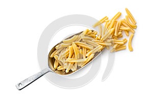 Uncooked pasta caserecce in metal scoop