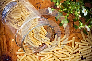 Uncooked pasta on a wooden surface