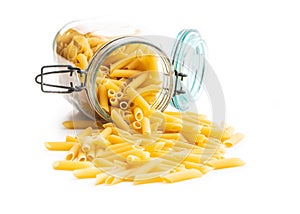Uncooked penne pasta. Dried italian pasta in jar