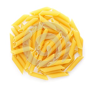 Uncooked penne pasta on white background