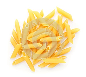 Uncooked penne pasta on white background