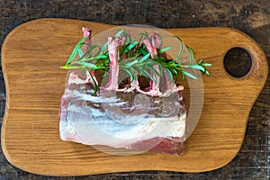 Uncooked rack of lamb with rosemary