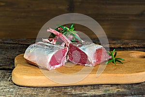 Uncooked rack of lamb with rosemary