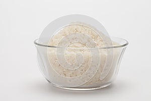 Uncooked rice in bowl with...