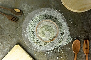 uncooked rice or dry rice. raw rice in wooden bowl with wooden spoon and fork