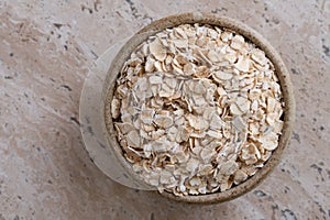 Uncooked Rolled Oats in a Bowl