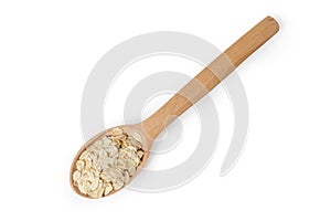 Uncooked rolled oats in wooden spoon on a white background