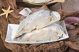 Uncooked salted cod on fishing nets