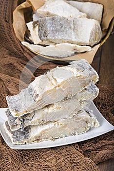 Uncooked salted cod on fishing nets