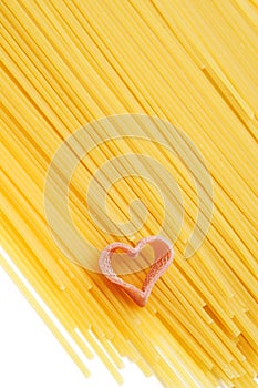 Uncooked spaghetti and heart