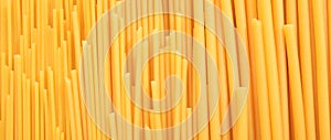 Uncooked spaghetti and macaroni pasta texture background, banner