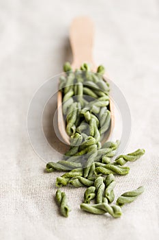Uncooked spinach gemelli pasta