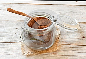 Uncooked teff grain in a glass jar