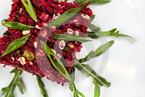 Uncooked vegetarian salad with beetroot and greensprouting seed photo