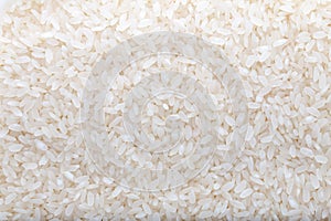 Uncooked white rice background.