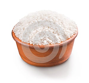 Uncooked white rice in bowl isolated