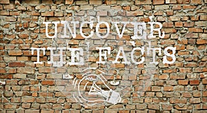 Uncover the facts is shown using the text and picture of the lamp on the wall