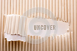 Uncover wording in a Rolled up torn paper