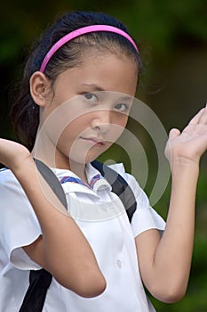 Undecided Filipina Girl Student With Books