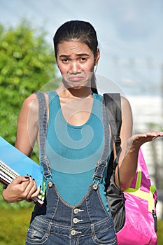 Undecided Minority School Girl Student With Books