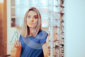 Undecided Woman Trying to find The Perfect Pair of Glasses