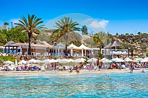 Undefinable People relaxing on Coral Bay Beach, one of the most famous beaches in Cyprus