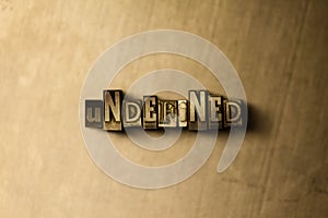 UNDEFINED - close-up of grungy vintage typeset word on metal backdrop