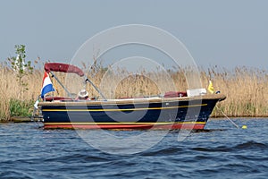 Undefined young couple women resting on boat floating on river