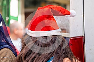 Undefined young woman wear santa hat