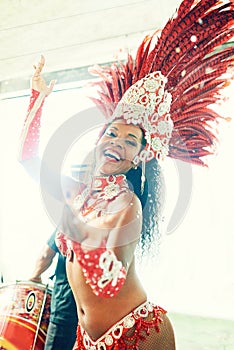 The undeniable seduction of samba. a beautiful samba dancer performing at a carnival.