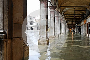 Under the arches in Saint Mark Square in Venice during flood