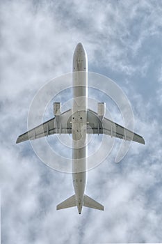 Under a big jet plane flying