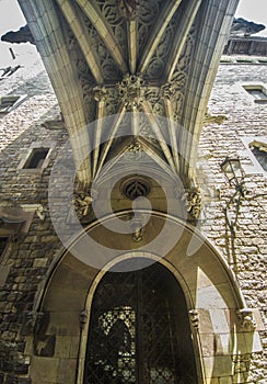 Under the bridge at Bisbe street in Barri Gotic, Barcelona photo