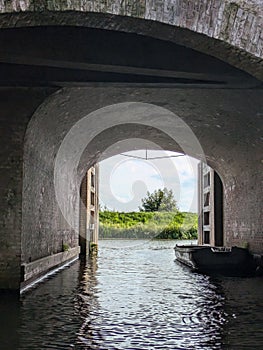 Under a bridge in the canal of Hertogenbosch photo