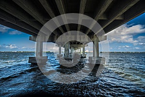 Under bridge with ocean water