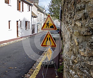 Under Construction Board Sign on the Closed Road with Arrow sign. Caution Symbol Under Construction in the Street in Ville de Jouy