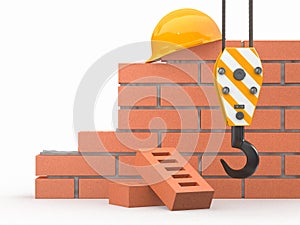 Under construction. Brick wall, crane and hardhat