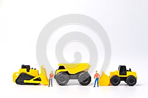 Under construction concept, with group of human toy and heavy du