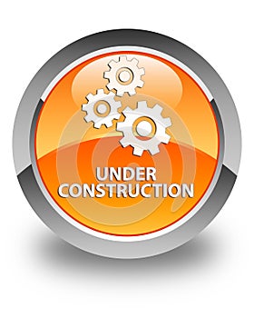 Under construction (gears icon) glossy orange round button