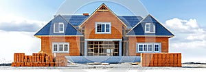Under Construction House with Building Materials