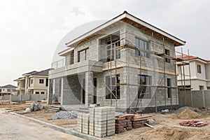 Under construction house with concrete block structure
