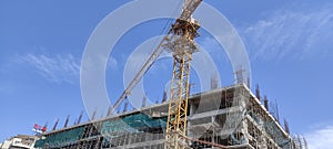 Under Construction Site with Crane and blue sky background