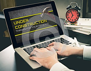 Under Construction website on computer.
