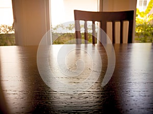 Under expose of wooden din table surface and wooden chair